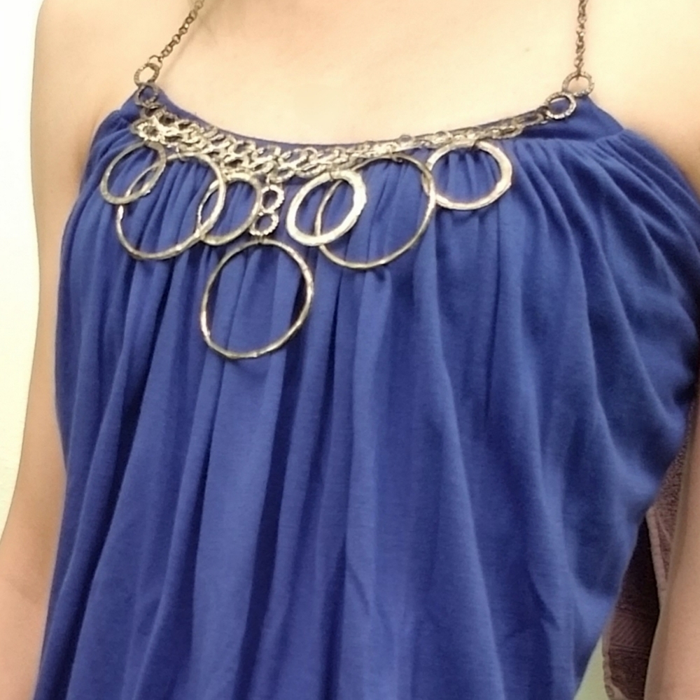 Flowy halter top with metallic ring accents